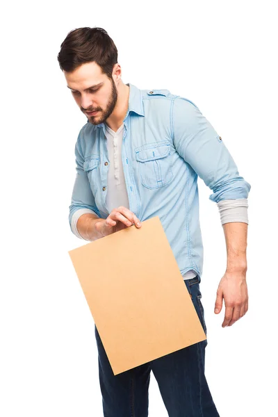 Young handsome man casual dressed with blank wooden panel — Stock Photo, Image