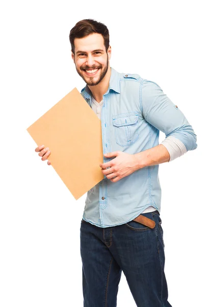 Junger gutaussehender Mann lässig gekleidet mit leerer Holzplatte — Stockfoto