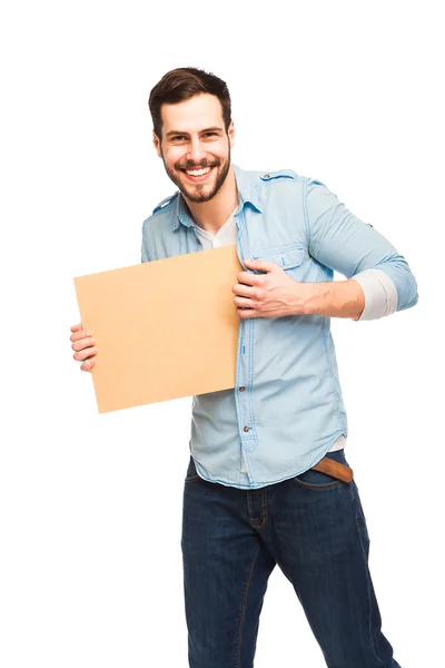 Young handsome man casual dressed with blank wooden panel — Stock Photo, Image