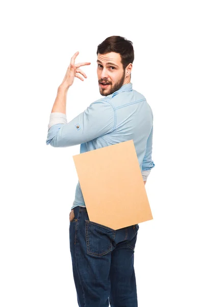 Joven hombre guapo casual vestido con panel de madera en blanco — Foto de Stock