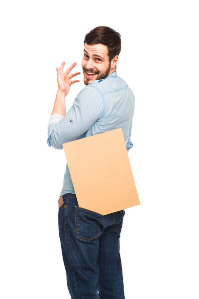 Young handsome man casual dressed with blank wooden panel