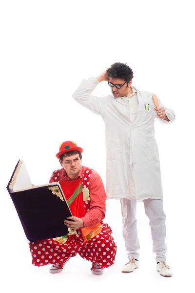 Crazy doctor and clowns playing on white background — Stock Photo, Image