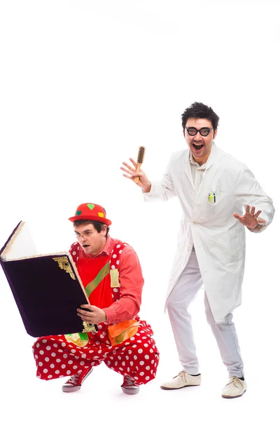 Crazy doctor and clowns playing on white background — Stock Photo, Image