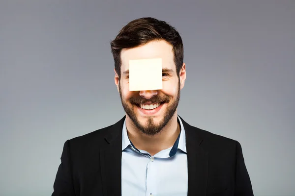 Postit en la cara del hombre — Foto de Stock