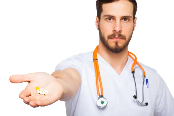 Doctor with pills in hand — Stock Photo, Image