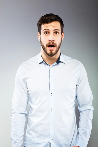 Portrait of a smart serious young man standing — Stock Photo, Image