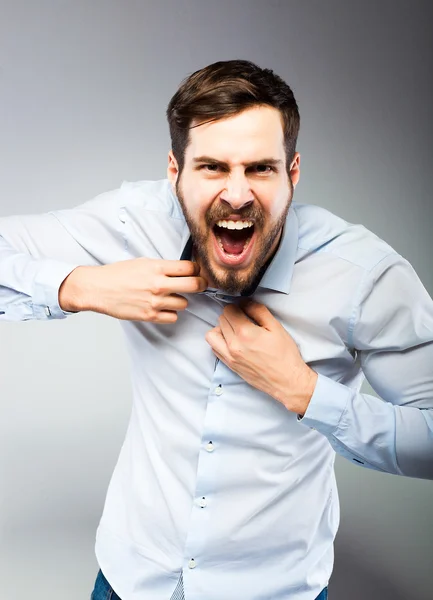 Portrait of a smart serious young man standing — Stock Photo, Image