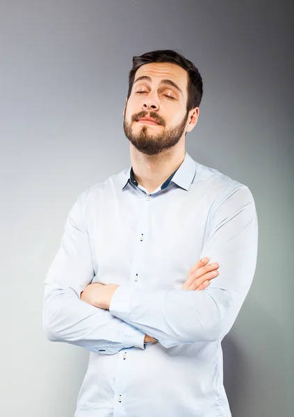 Portrait of a smart serious young man standing — Stock Photo, Image