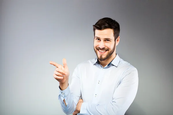 Portrait of a smart serious young man standing — Stock Photo, Image