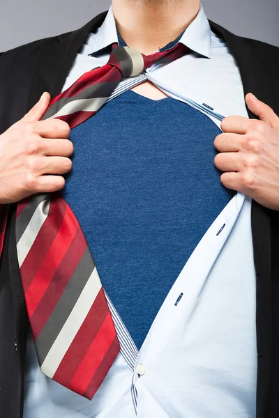 Young businessman acting like a super hero — Stock Photo, Image