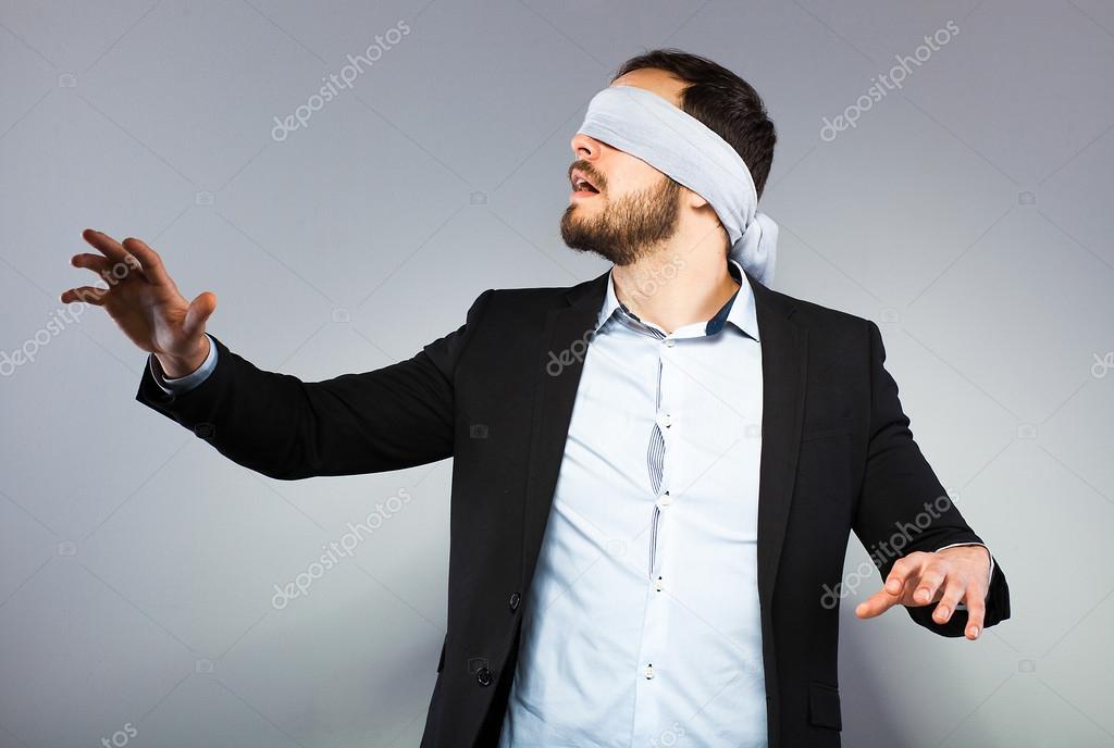 Blindfolded elegant man Stock Photo by ©brasoveanub 44815667