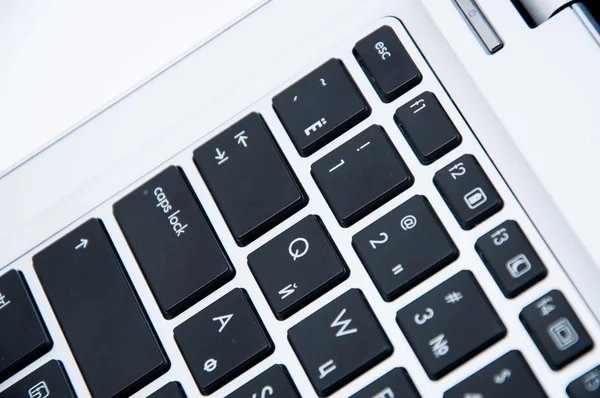 Part of a laptop keyboard on a white background — Stock Photo, Image