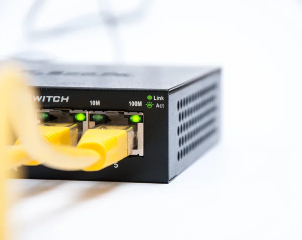 Yellow cable connected to the router — Stock Photo, Image