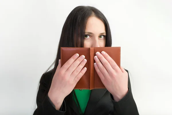 Girl hiding behind the book — Stock Photo, Image