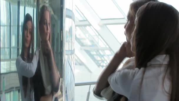 Woman checking her face in the mirror — Stock Video