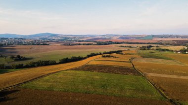 Ukrainian fields stretch on the hills near the settlements Aerial view 