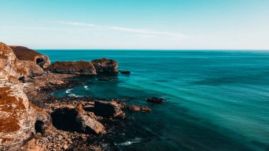 Seascape of the Atlantic Ocean bay with rocks above the water. Aerial view