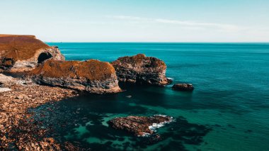 Seascape of the Atlantic Ocean bay with rocks above the water. Aerial view