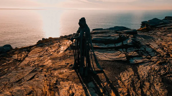 Aerial view around the Monument to King Arthur in Britain Monument close up on sea background.