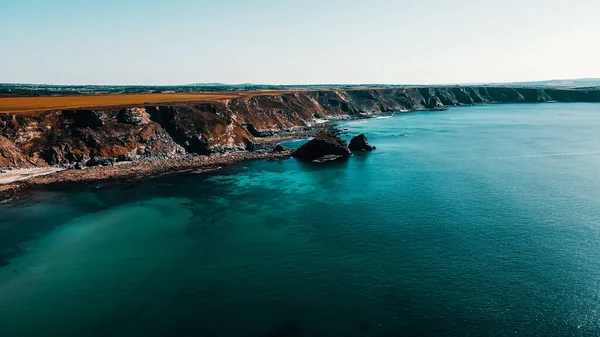 Rocks Ocean Coast Line Turquoise Water Dramatic Cliffs Aerial View 免版税图库图片