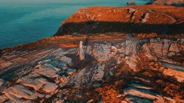 Aerial view around the Monument to King Arthur in Britain Monument close up on sea background 