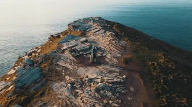 Aerial view around the Monument to King Arthur in Britain Monument close up on sea background