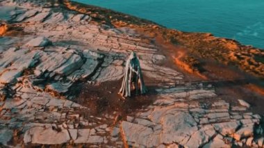 Aerial view around the Monument to King Arthur in Britain Monument close up on sea background 
