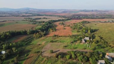 Flight over the fields behind the western Ukrainian village Aerial view.