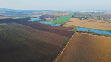 Flight over the fields behind the western Ukrainian village Aerial view.