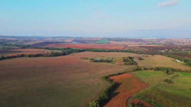 Ukrainian fields stretch on the hills near the settlements Aerial view 