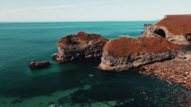 Seascape of the Atlantic Ocean bay with rocks above the water. Aerial view.