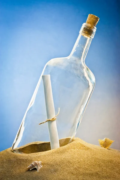 Message in bottle on sand — Stock Photo, Image