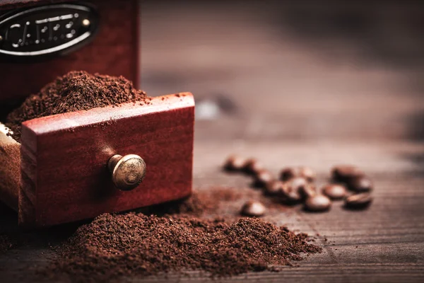 Coffee grinder and powder — Stock Photo, Image