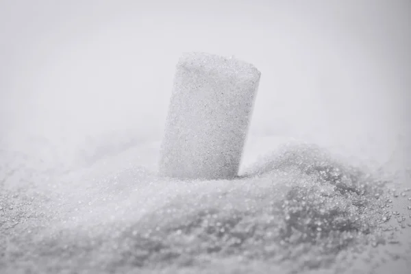 Grãos e cubos de açúcar — Fotografia de Stock