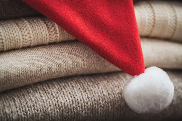 Wool sweaters and Christmas hat — Stock Photo, Image