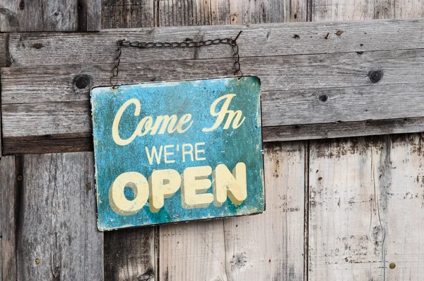 Vintage open sign on old wooden door — Stock Photo, Image