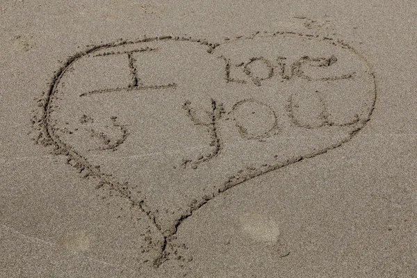 Bericht in zand strand "i love you" — Stockfoto