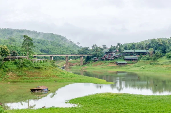 Rural life view of wooden Mon Bridge in Sangkhla Buri, Kanchanaburi Province , Thailand