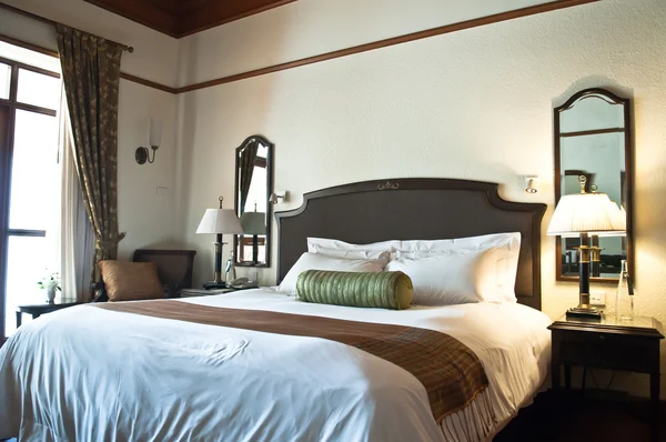 Bed in a hotel room — Stock Photo, Image