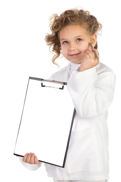 Κορίτσι στο κοστούμι του γιατρού παίρνει σημειώσεις. απομονώνονται σε λευκό φόντο Εικόνα Αρχείου