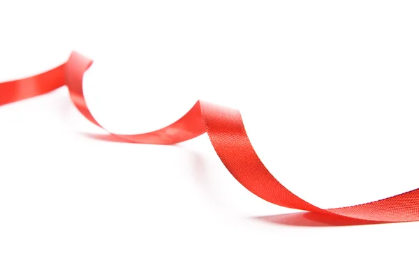 Shiny red satin ribbon on white background — Stock Photo, Image