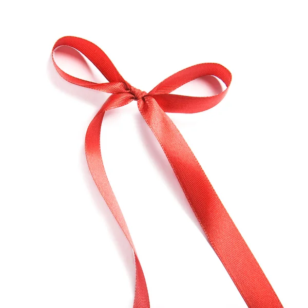 Shiny red satin ribbon and bow on white background — Stock Photo, Image