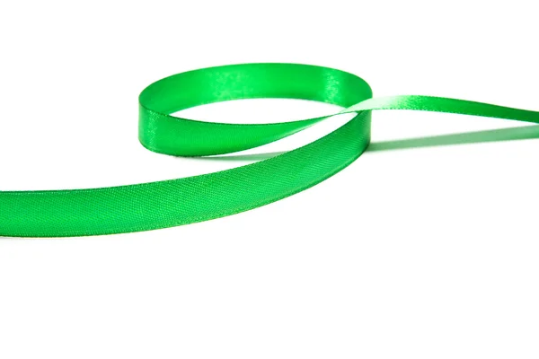 Shiny green satin ribbon on white background — Stock Photo, Image