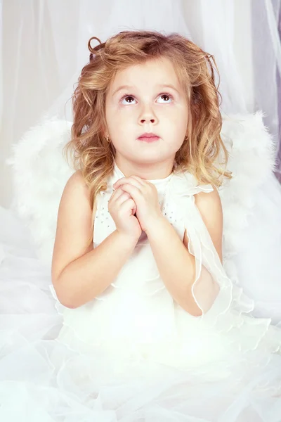 The beautiful little girl in an image of an angel — Stock Photo, Image