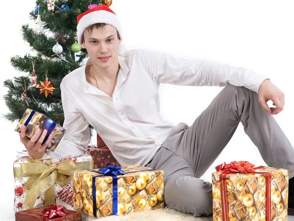 The young handsome guy, in New Year's scenery — Stock Photo, Image