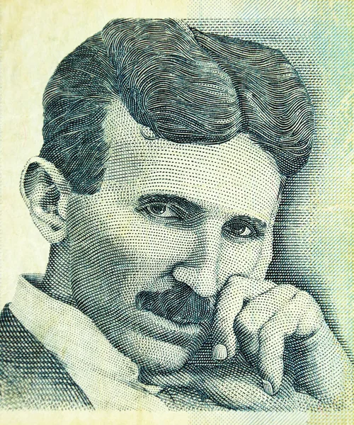 stock image Portrait of Nikola Tesla, famous serbian scientist, engraving on old banknote of the bank of Serbia