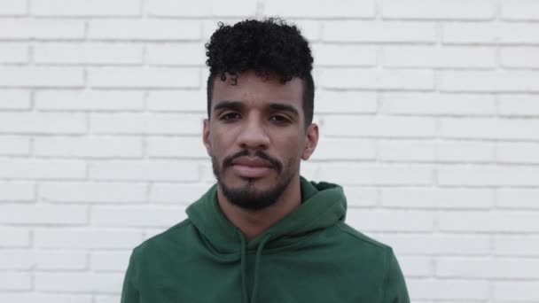 Portrait of smiling young latin man looking at camera — Stock Video