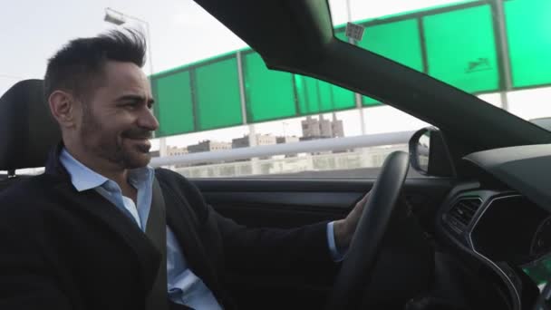 Successful middle age business man driving a cabriolet car — Video