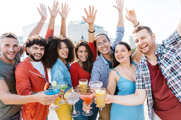 Group portrait of multiracial young friends drinking cocktail at summer party —  Fotos de Stock