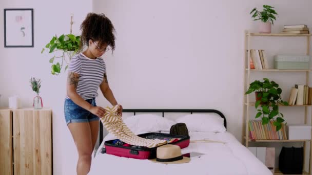 Happy Young African American Woman Packing Clothes Luggage Home Going — Stockvideo